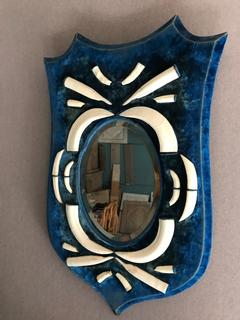 19 th century mirror in bleu velvet with warthdog teeth
